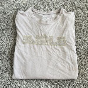 Pale pink men’s Nike top